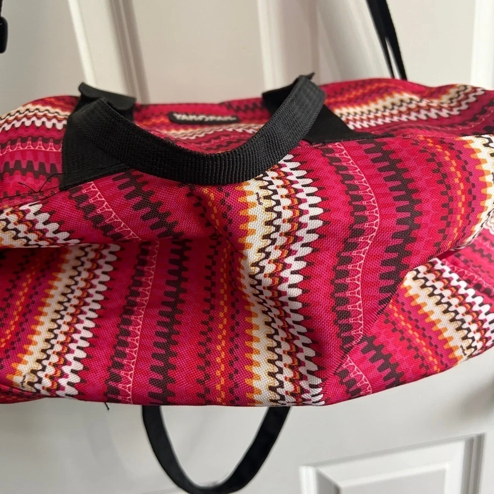 Like new YakPak duffle bag. Pink colorful zigzag design with black details